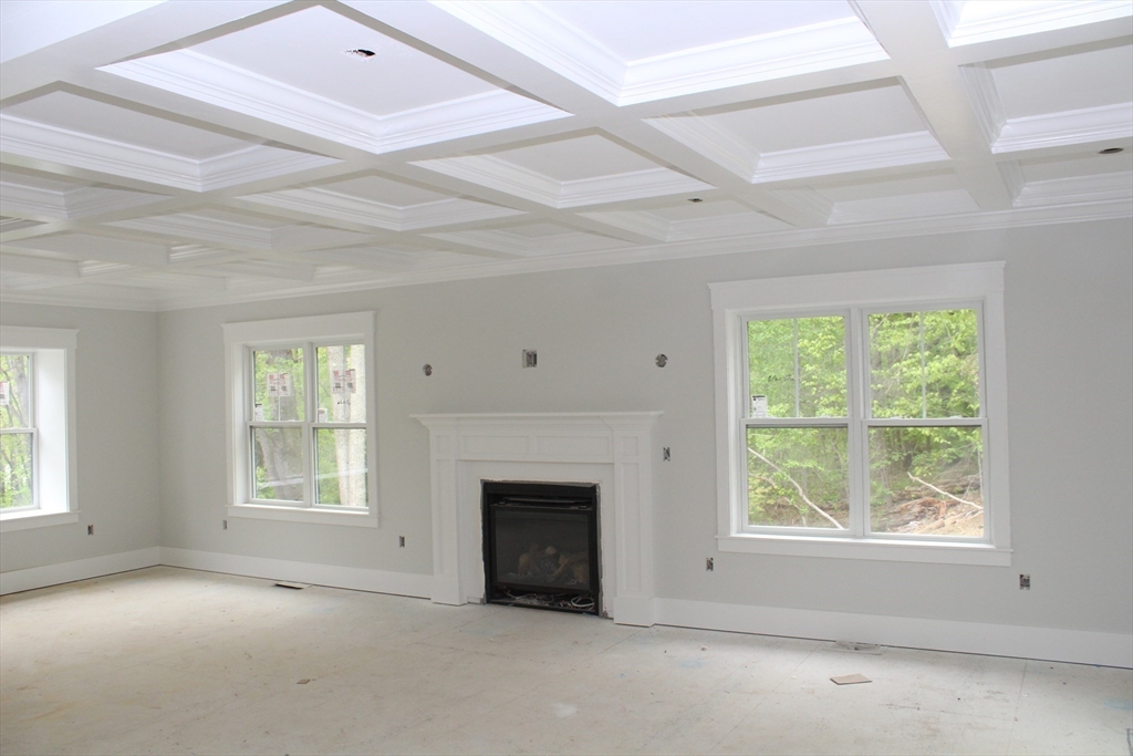 30 Mendon Street Upton, MA 01568 - Photo 11 of 26 an empty room with windows and fireplace
