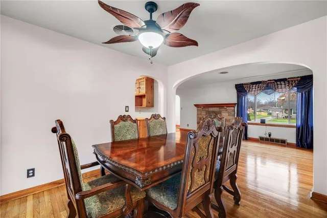 a dining room with furniture and window