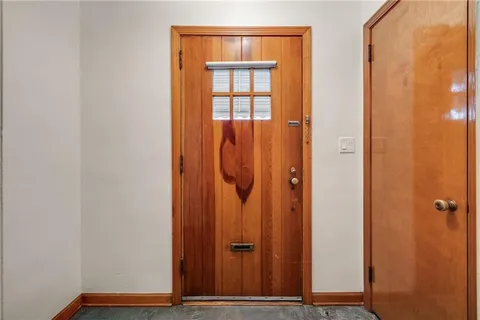 wooden door with glass door