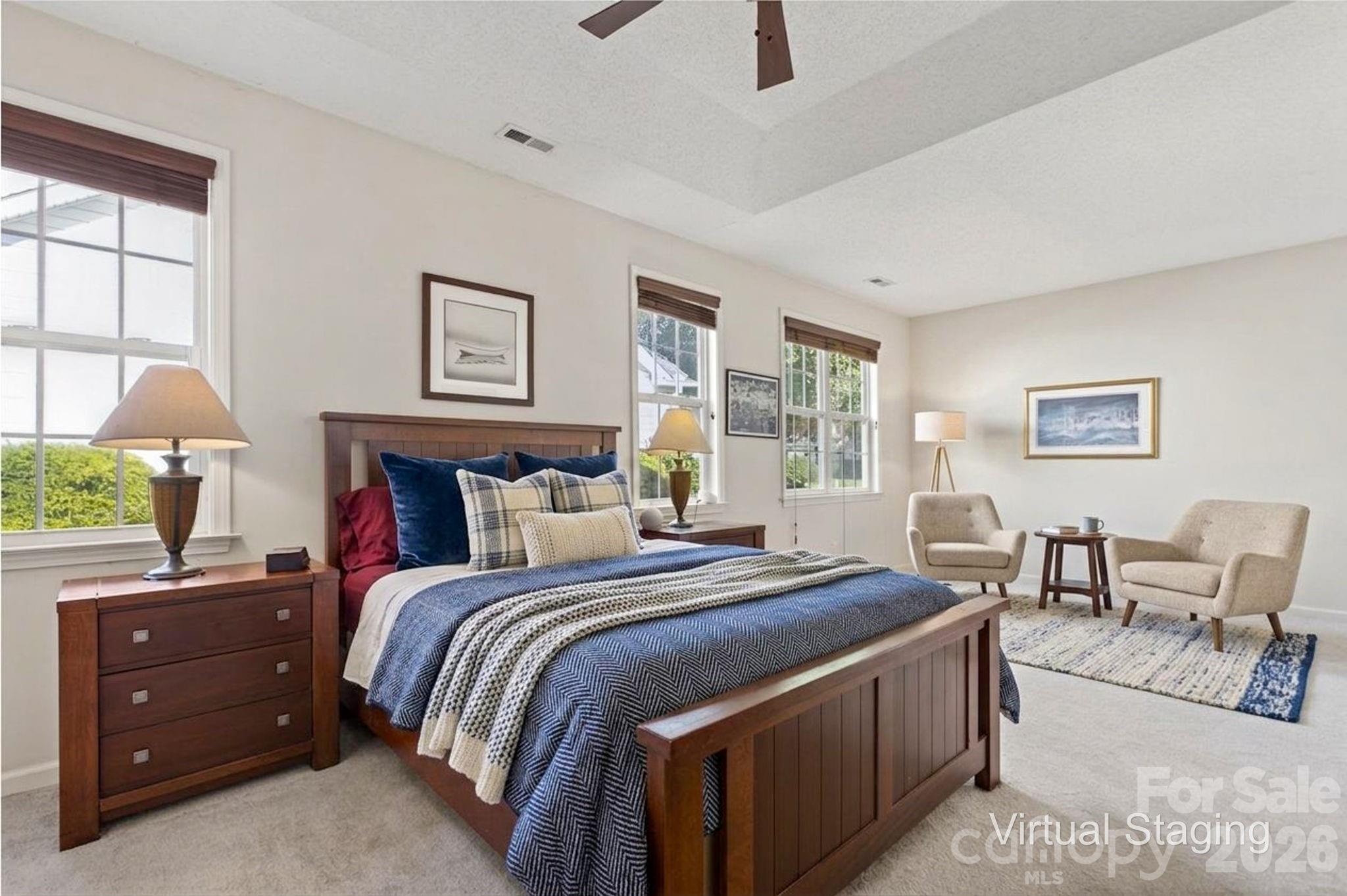 268 Farm Valley Road Fletcher, NC 28732 - Photo 20 of 30 a bedroom with a bed a table and chair