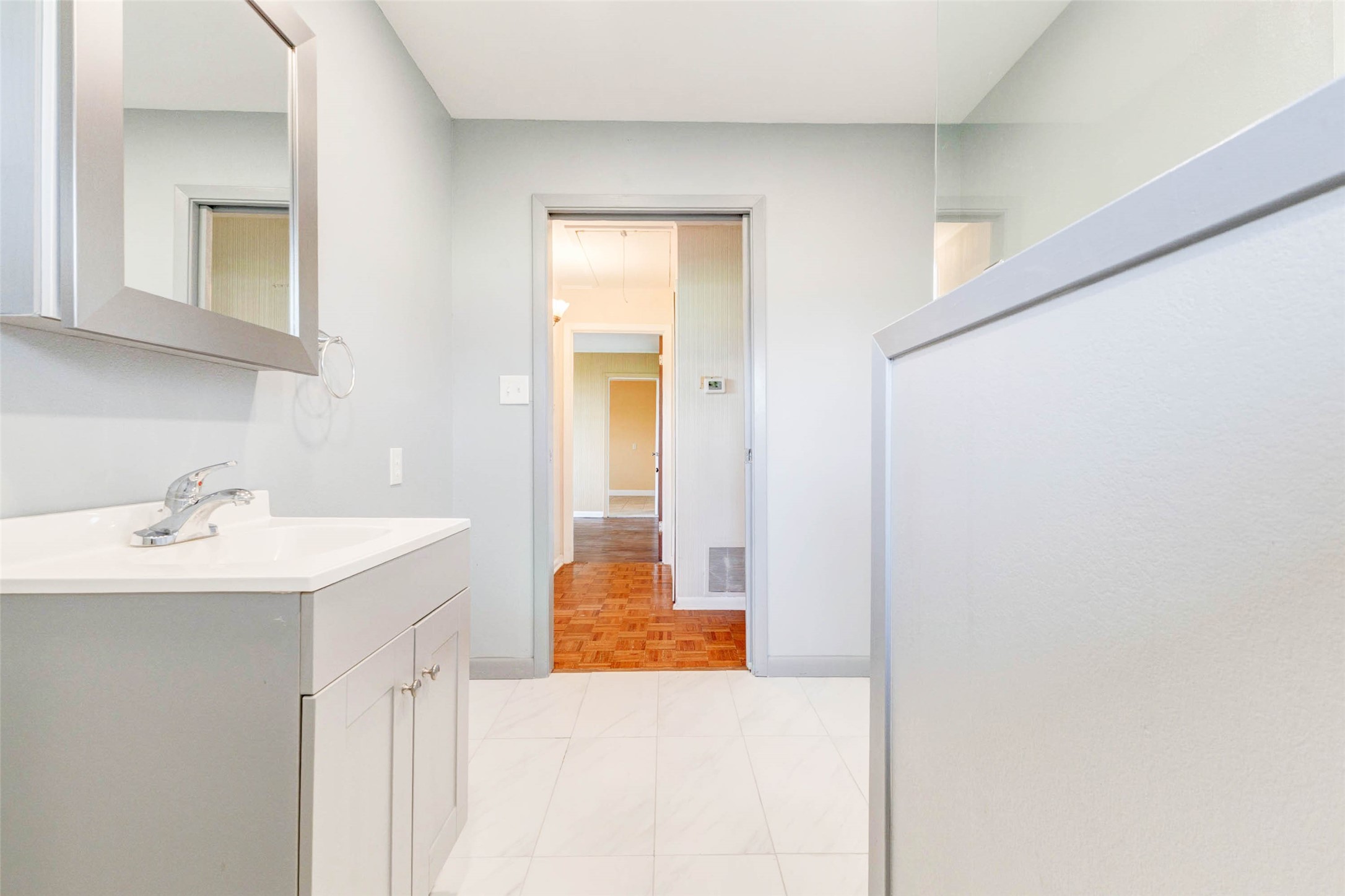 925 Norcross Road Wallis, TX 77485 - Photo 25 of 46 Thoughtfully remodeled, this stylish bathroom features a walk-in shower, contemporary finishes, and an spacious vanity, offering comfort, convenience, and timeless appeal.