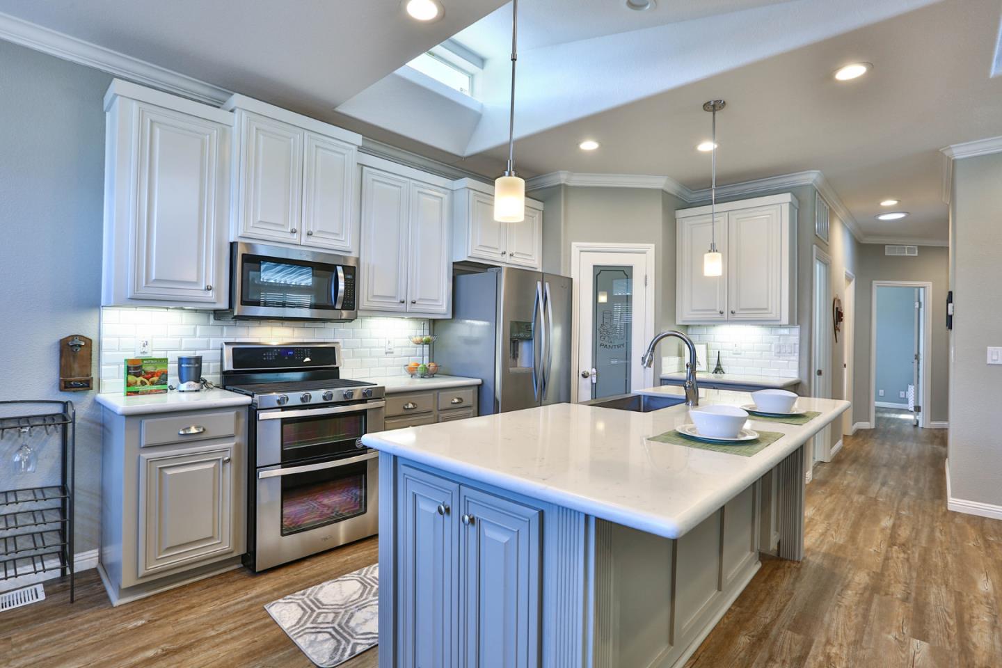 136 Timber Cove Drive, Unit 136 Campbell, CA 95008 - Photo 11 of 36 a kitchen with kitchen island a sink stove and refrigerator