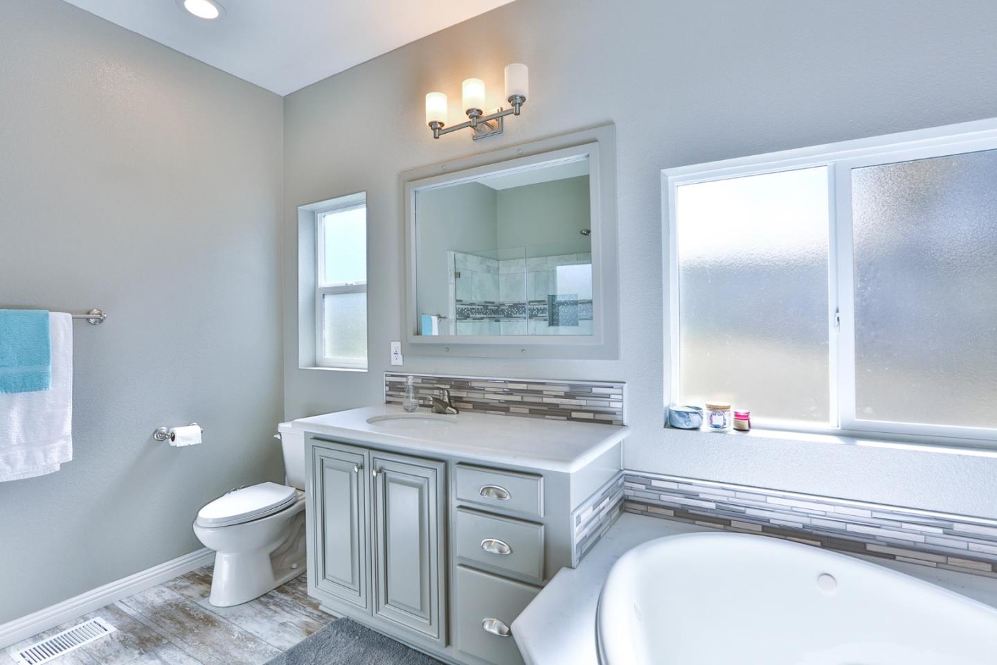 136 Timber Cove Drive, Unit 136 Campbell, CA 95008 - Photo 20 of 36 a bathroom with a toilet sink and mirror