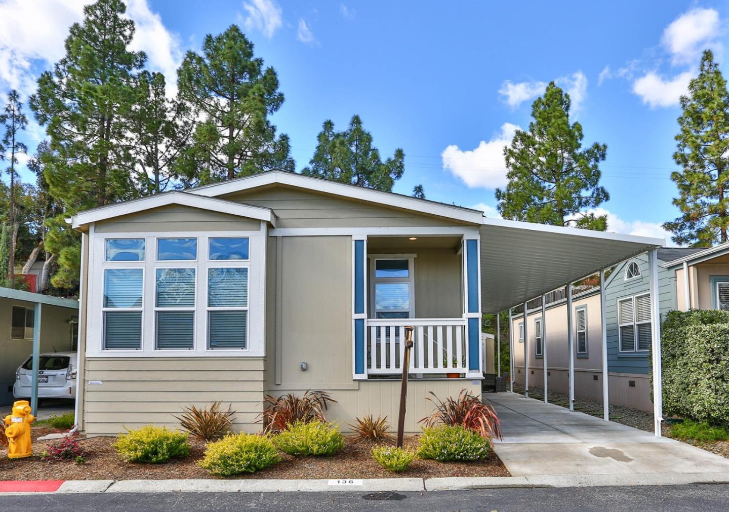 136 Timber Cove Drive, Unit 136 Campbell, CA 95008 - Photo 2 of 36 a front view of a house with a yard