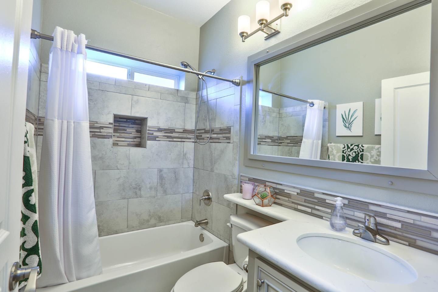 136 Timber Cove Drive, Unit 136 Campbell, CA 95008 - Photo 25 of 36 a bathroom with a bathtub shower sink and mirror