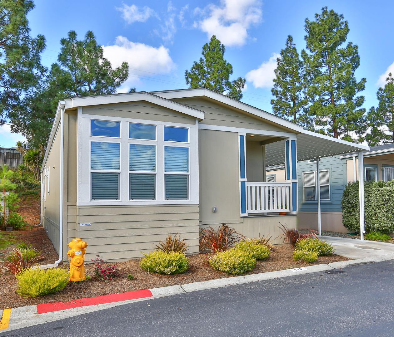 136 Timber Cove Drive, Unit 136 Campbell, CA 95008 - Photo 3 of 36 a front view of a house with a yard and outdoor seating