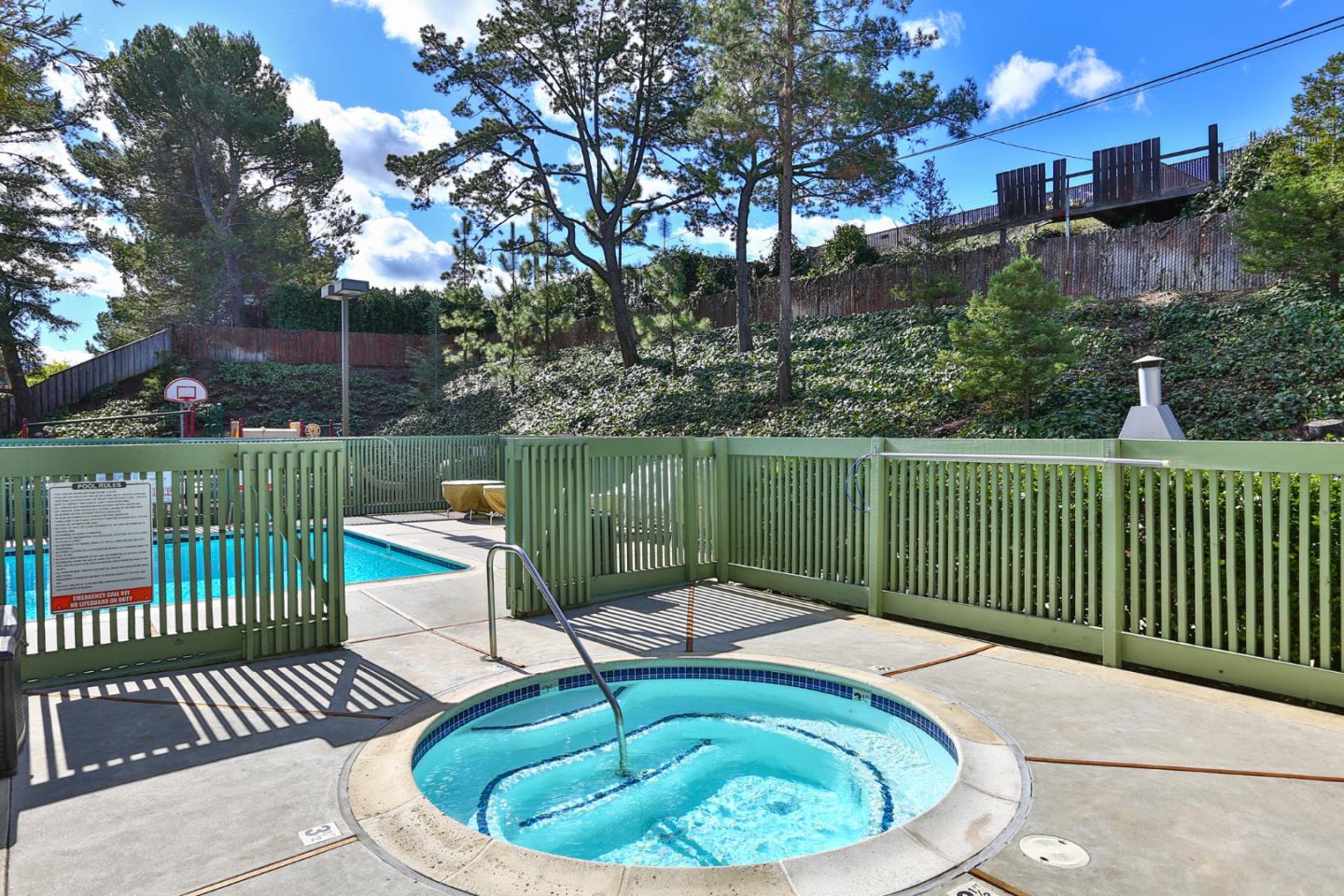 136 Timber Cove Drive, Unit 136 Campbell, CA 95008 - Photo 35 of 36 a view of a swimming pool with a patio and a garden