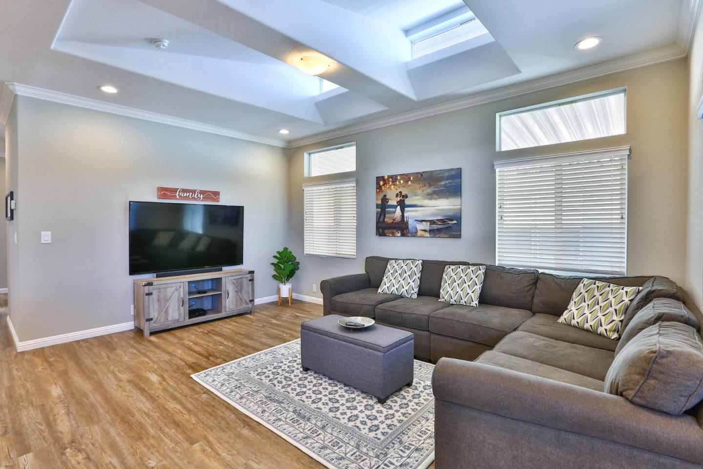 136 Timber Cove Drive, Unit 136 Campbell, CA 95008 - Photo 5 of 36 a living room with furniture and a flat screen tv