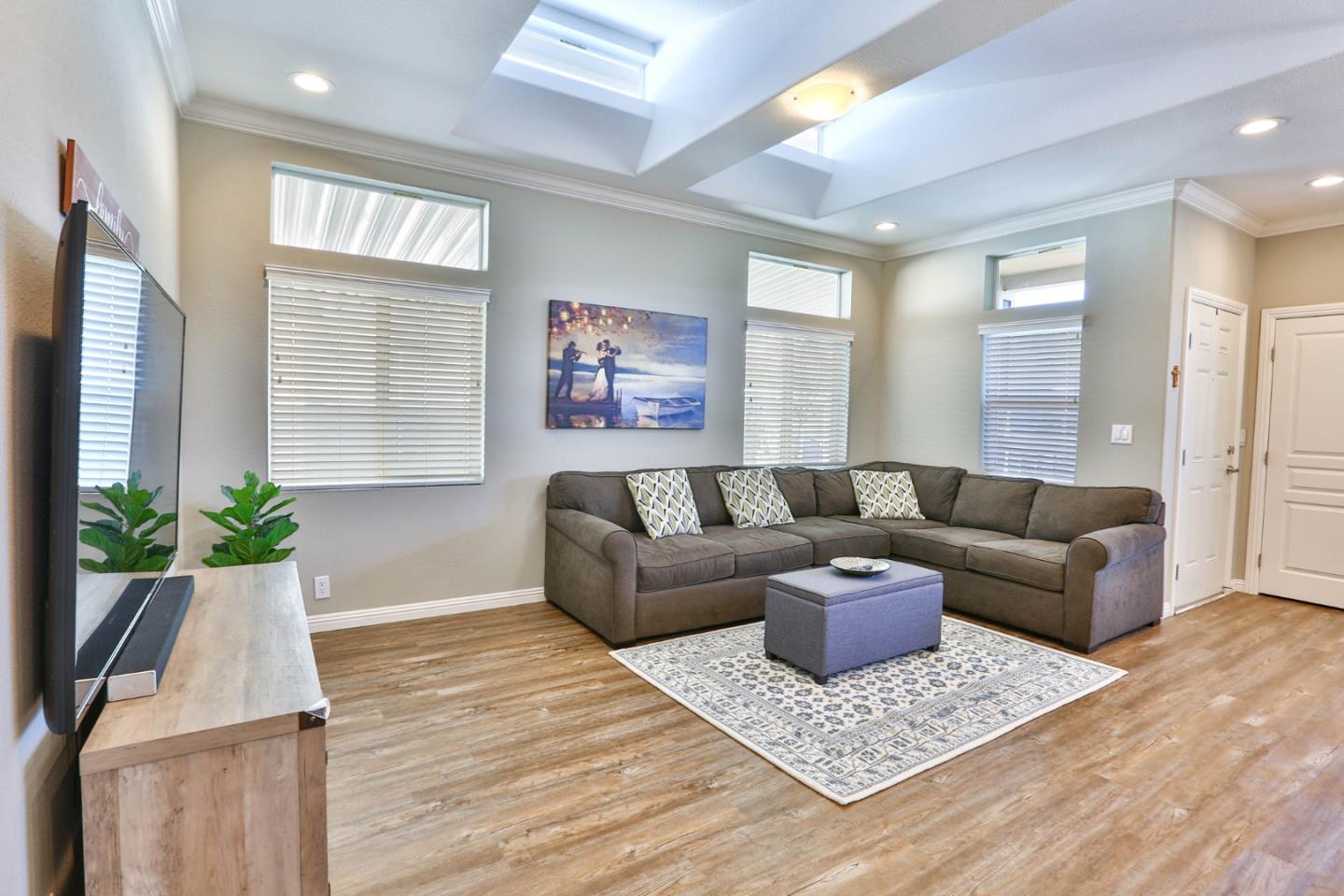 136 Timber Cove Drive, Unit 136 Campbell, CA 95008 - Photo 7 of 36 a living room with furniture and a potted plant