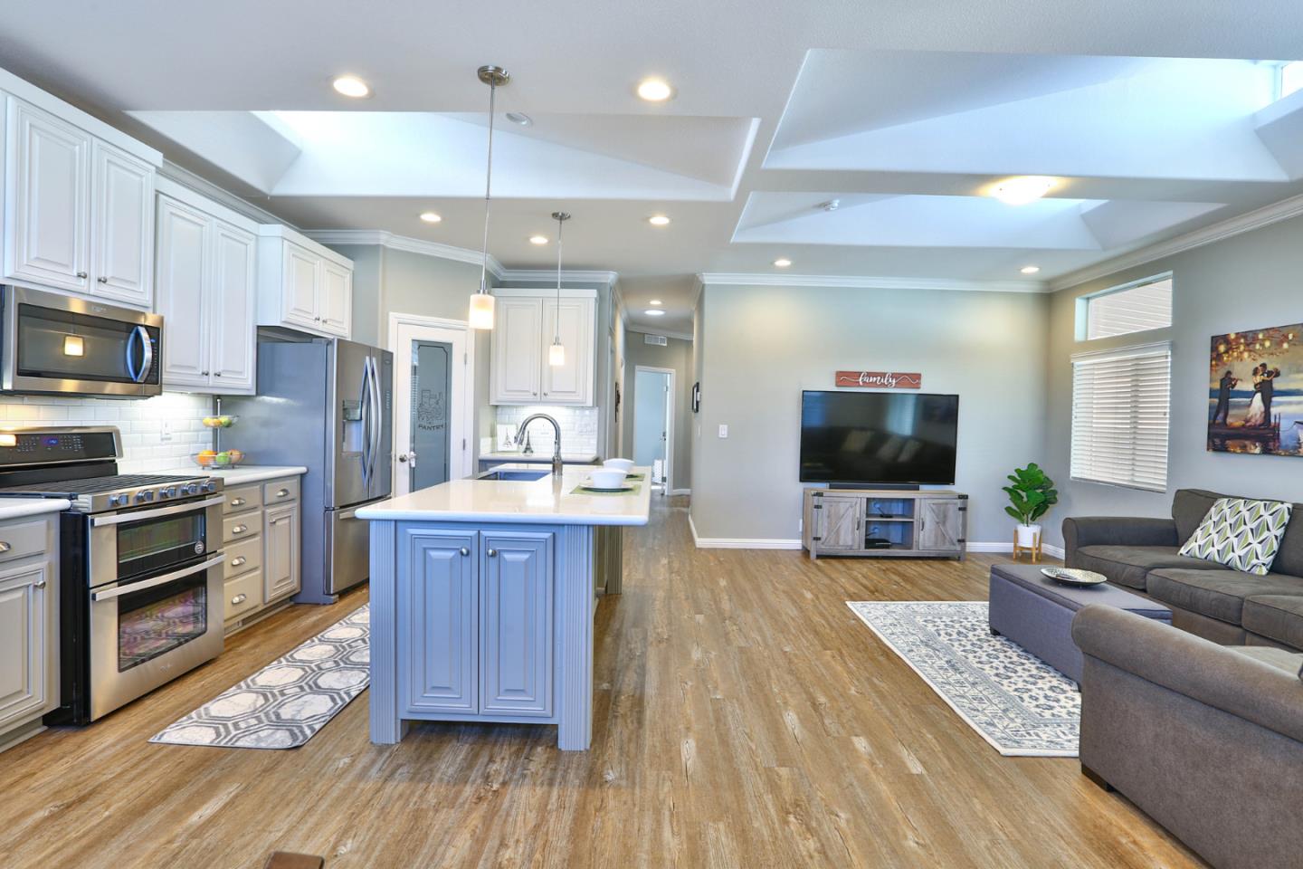 136 Timber Cove Drive, Unit 136 Campbell, CA 95008 - Photo 9 of 36 a large kitchen with cabinets a sink a counter space and stainless steel appliances