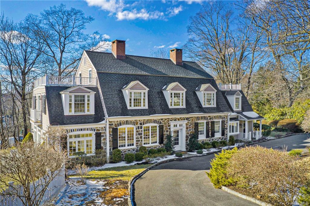 a front view of a residential apartment building with a yard
