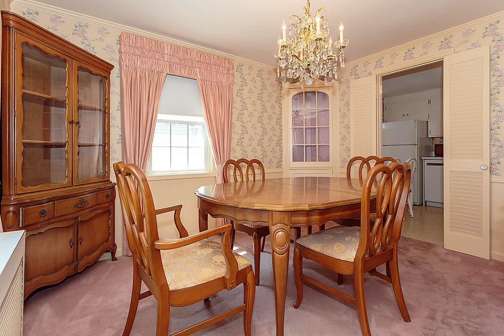 45 Magnolia Road Milton, MA 02186 - Photo 11 of 26 a dining room with furniture a chandelier and window
