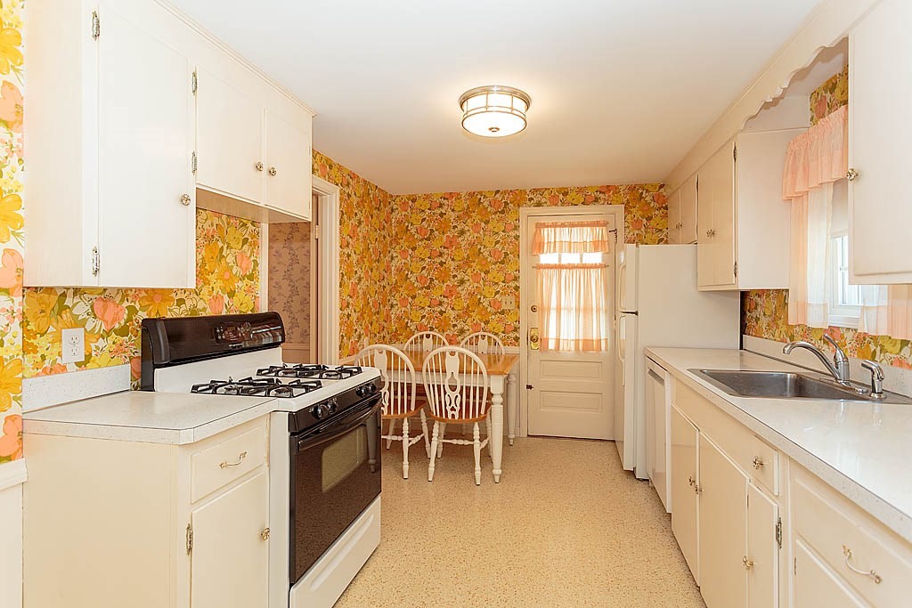 45 Magnolia Road Milton, MA 02186 - Photo 13 of 26 a kitchen with stainless steel appliances a stove sink and cabinets