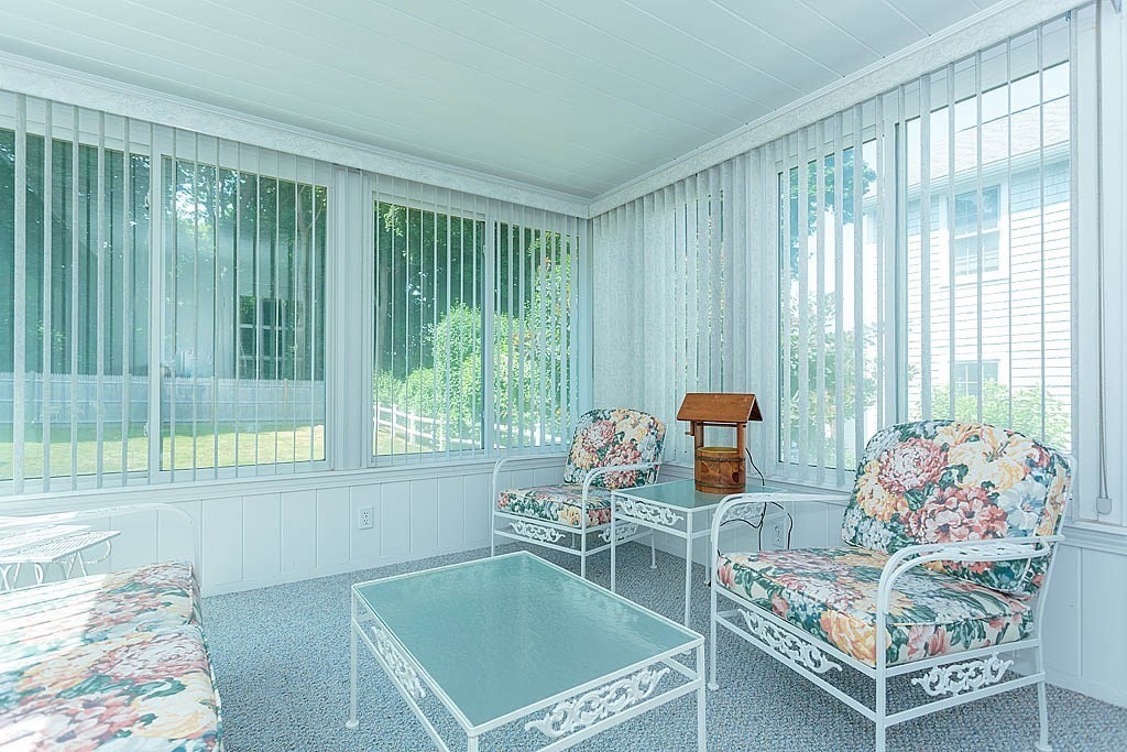 45 Magnolia Road Milton, MA 02186 - Photo 16 of 26 a living room with furniture and a large window