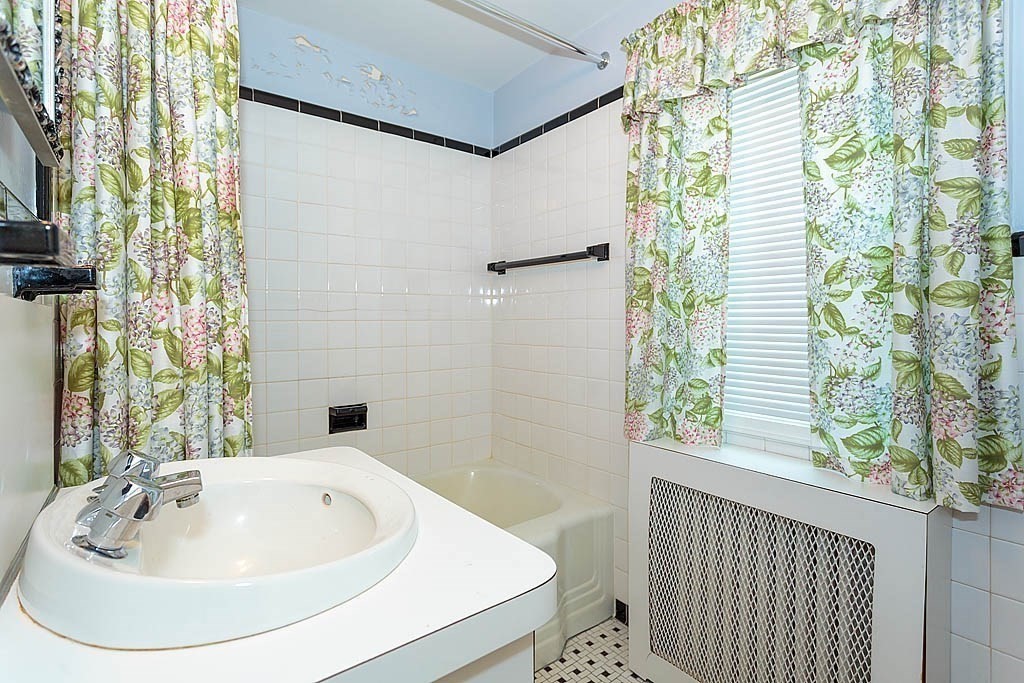 45 Magnolia Road Milton, MA 02186 - Photo 17 of 26 a bathroom with a sink and a bathtub