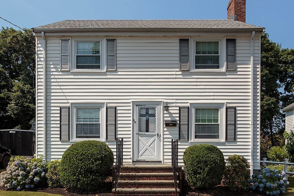 45 Magnolia Road Milton, MA 02186 - Photo 2 of 26 a view of a house with more windows and flower plants