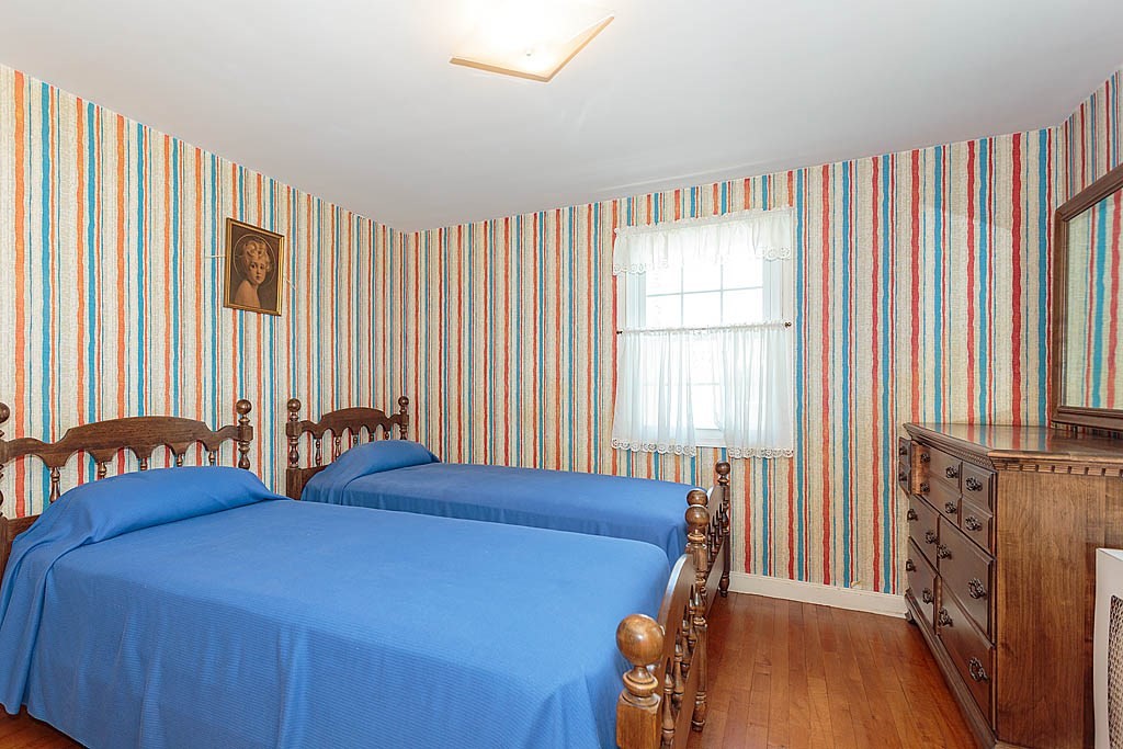 45 Magnolia Road Milton, MA 02186 - Photo 23 of 26 a bedroom with two beds and a large window