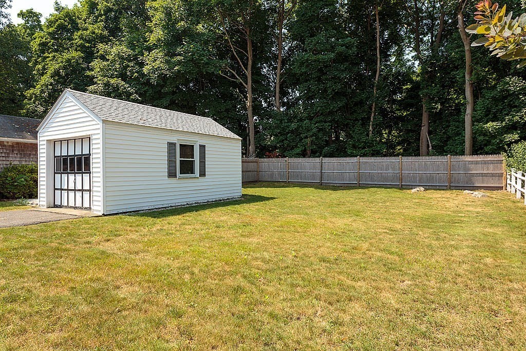 45 Magnolia Road Milton, MA 02186 - Photo 5 of 26 a view of a house with a backyard