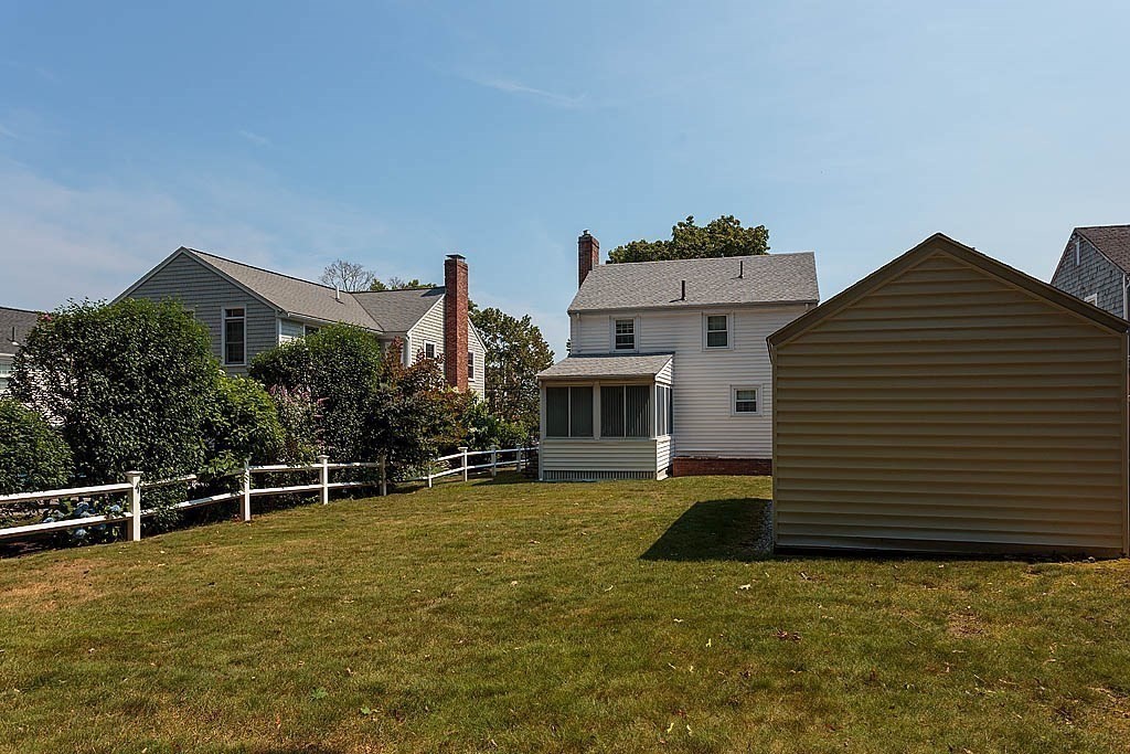 45 Magnolia Road Milton, MA 02186 - Photo 6 of 26 a front view of a house with a yard