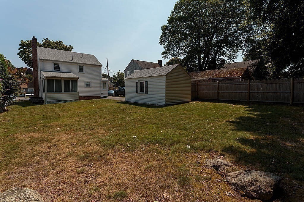 45 Magnolia Road Milton, MA 02186 - Photo 8 of 26 a view of a house with a yard