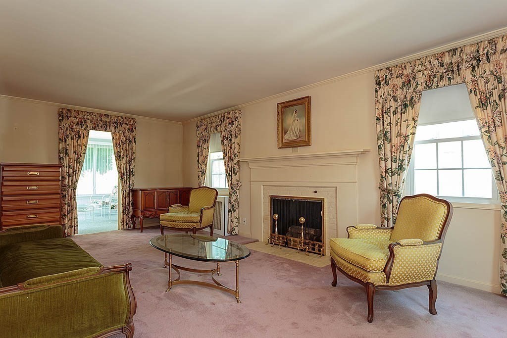 45 Magnolia Road Milton, MA 02186 - Photo 9 of 26 a living room with furniture and a fireplace