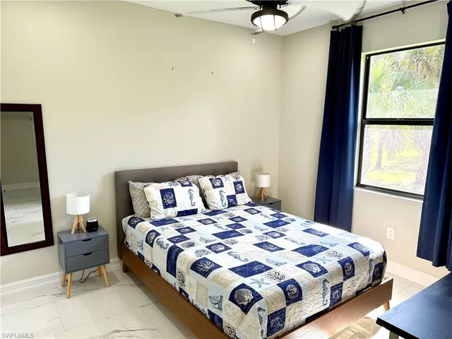 a spacious bathroom with a mirror a sink and a shower