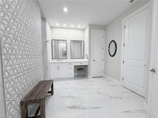 a view of kitchen with white cabinets and a white counter top