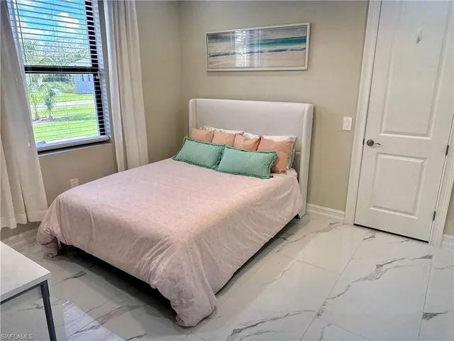 a bathroom with a double vanity sink a mirror and a shower