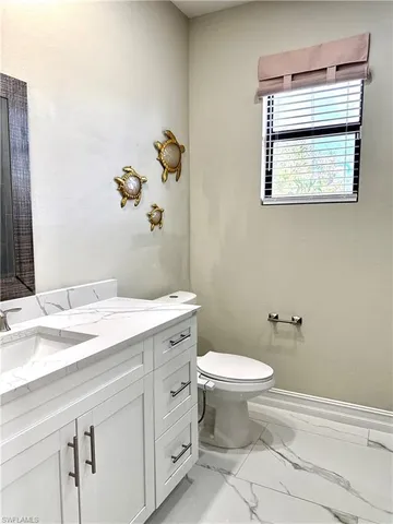 a bathroom with a shower a toilet and sink