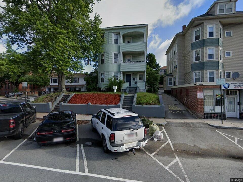 57 Hamilton Street, Unit 1 Worcester, MA 01604 - Photo 1 of 14 a front view of a building with cars parked