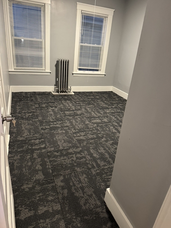 57 Hamilton Street, Unit 1 Worcester, MA 01604 - Photo 12 of 14 a view of empty room with windows