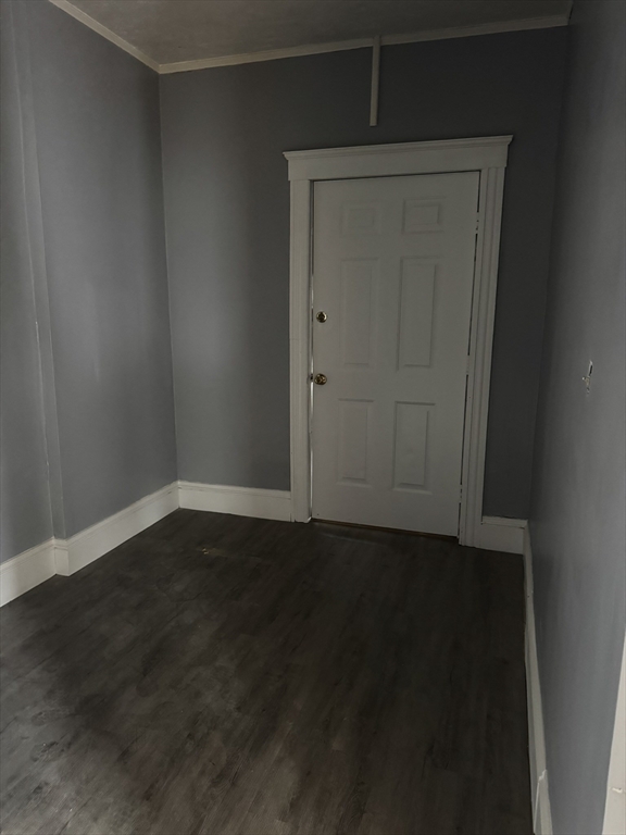 57 Hamilton Street, Unit 1 Worcester, MA 01604 - Photo 14 of 14 an empty room with wooden floor and closet in it