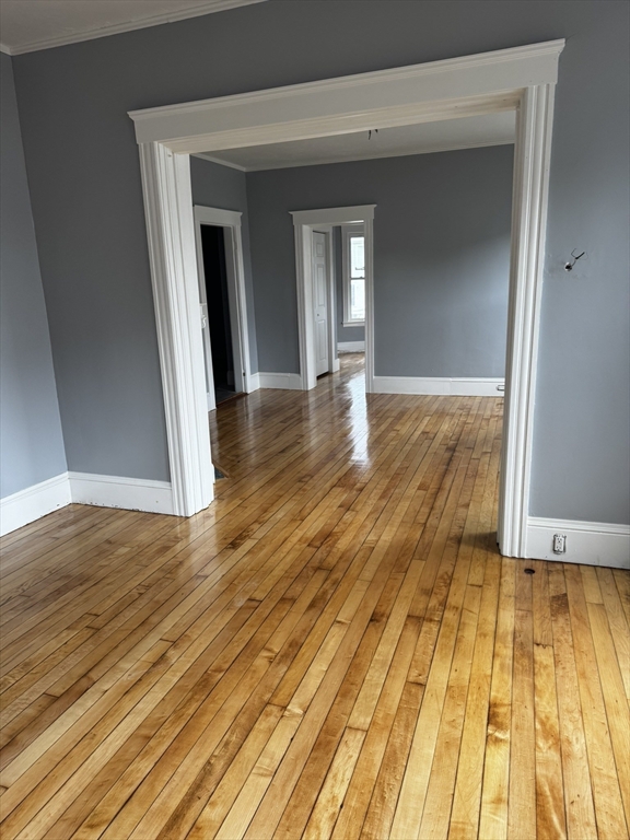 57 Hamilton Street, Unit 1 Worcester, MA 01604 - Photo 9 of 14 a view of empty room with wooden floor