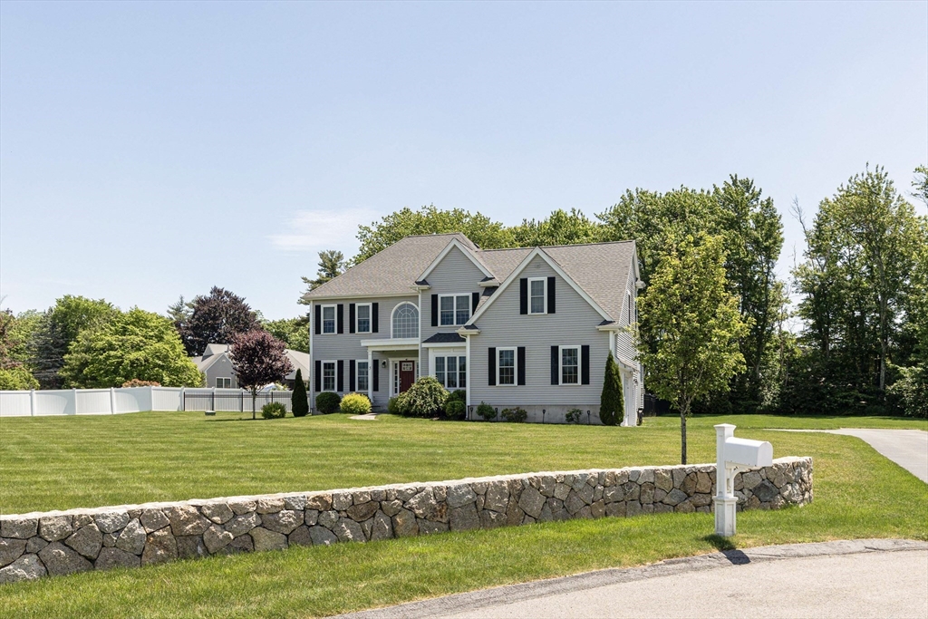 5 Box Mill Road Hopkinton, MA 01748 - Photo 2 of 42 a front view of a house with a yard
