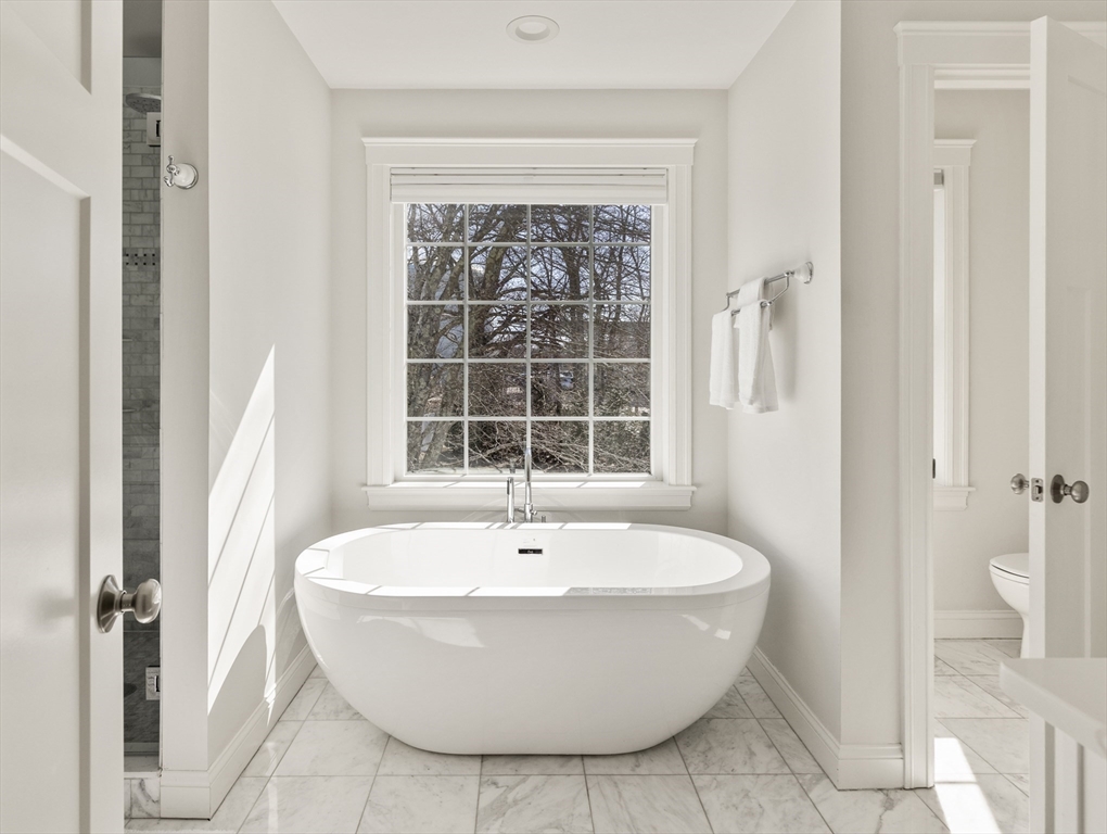 5 Box Mill Road Hopkinton, MA 01748 - Photo 28 of 42 a white bath tub sitting next to a window