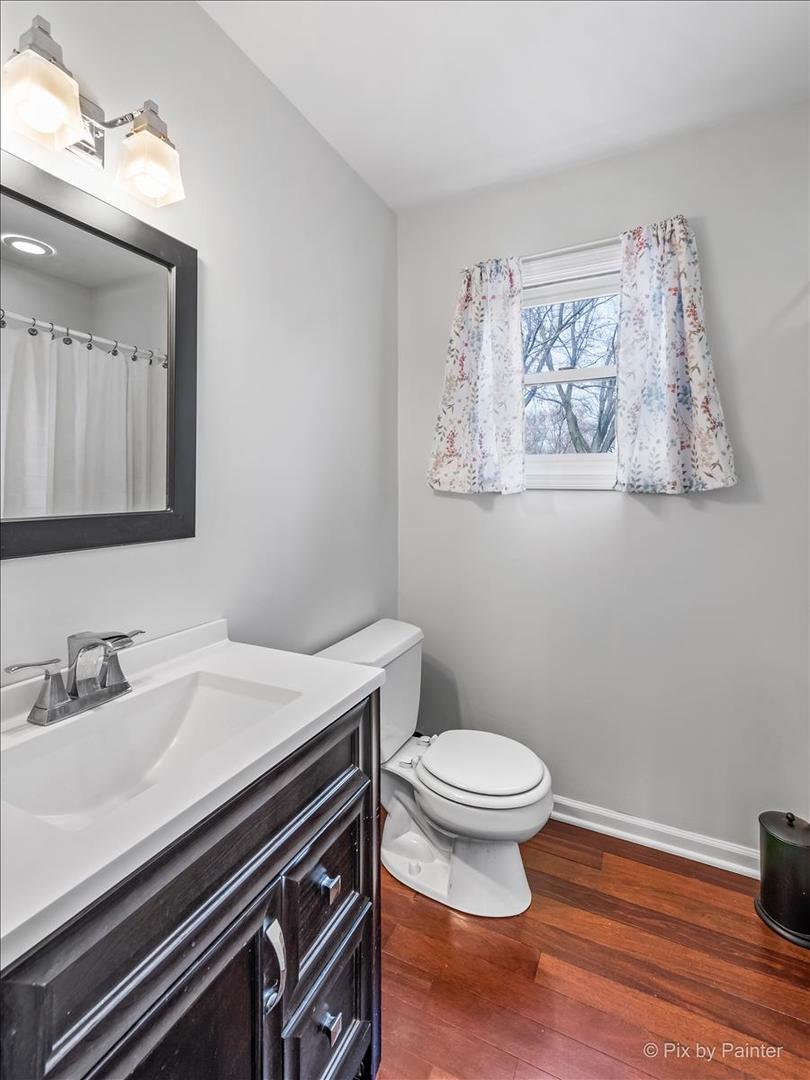 254 Perth Road Cary, IL 60013 - Photo 15 of 36 a bathroom with a sink and a mirror
