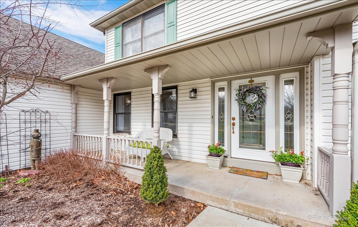 254 Perth Road Cary, IL 60013 - Photo 2 of 36 a front view of a house with a porch
