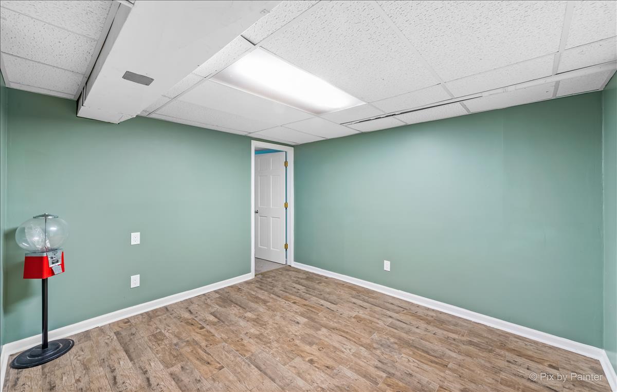 254 Perth Road Cary, IL 60013 - Photo 25 of 36 a view of a room with a ceiling fan and carpet