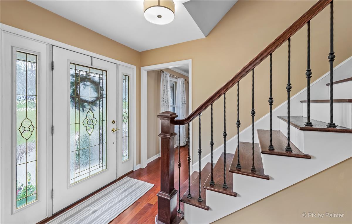254 Perth Road Cary, IL 60013 - Photo 3 of 36 a view of an entryway with wooden floor