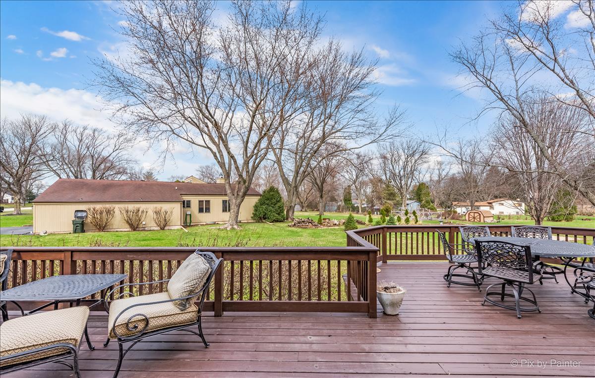 254 Perth Road Cary, IL 60013 - Photo 31 of 36 a view of a wooden chairs and bench on the deck