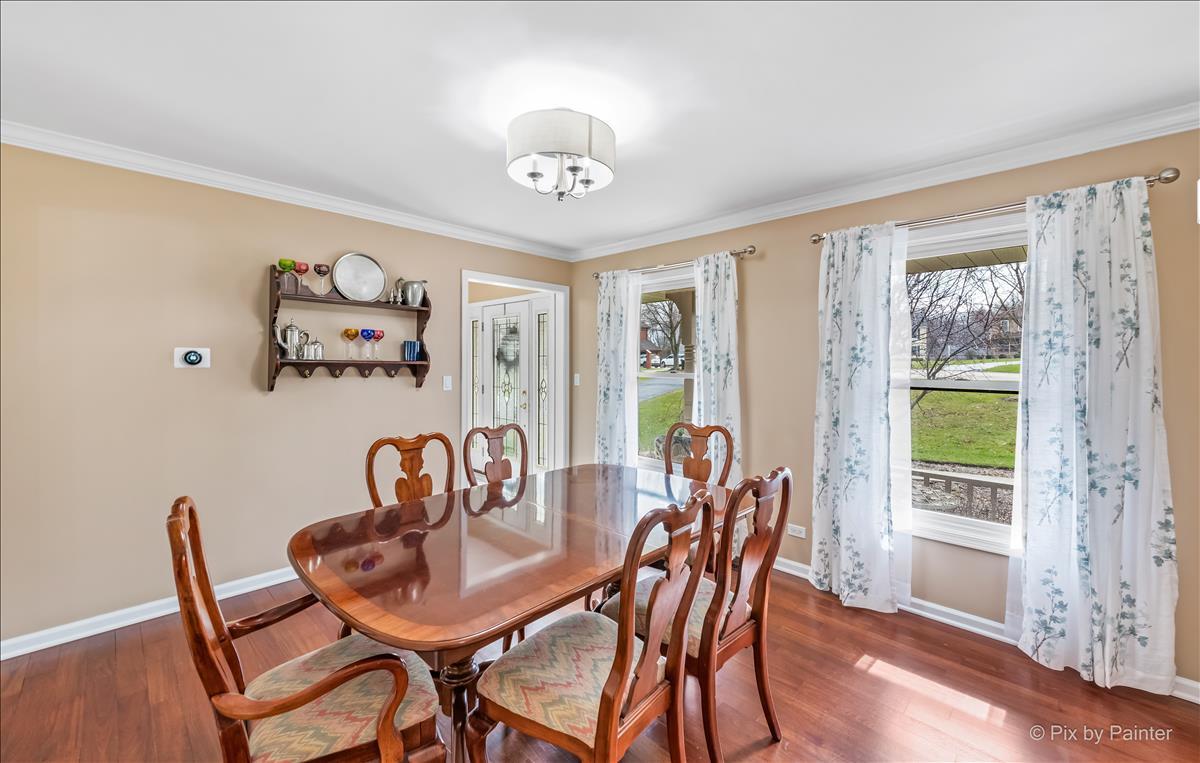 254 Perth Road Cary, IL 60013 - Photo 4 of 36 a view of a dining room with furniture window and wooden floor