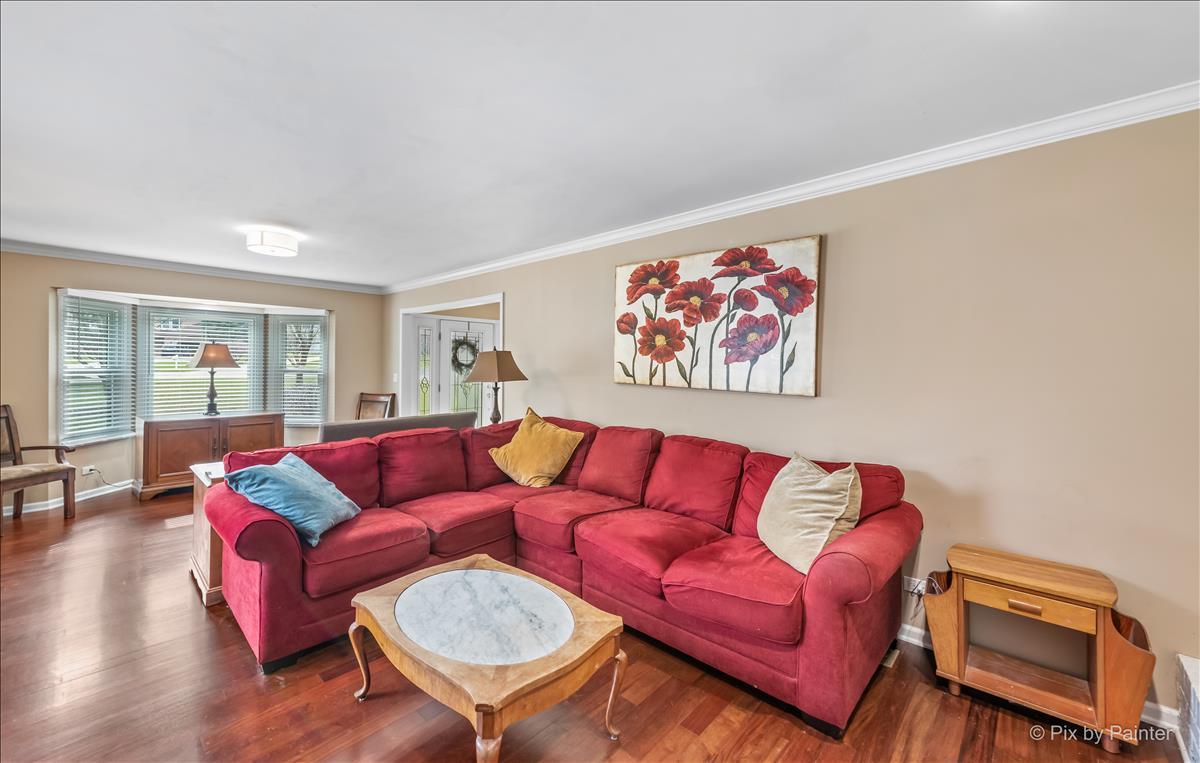 254 Perth Road Cary, IL 60013 - Photo 6 of 36 a living room with furniture a couch and wooden floor