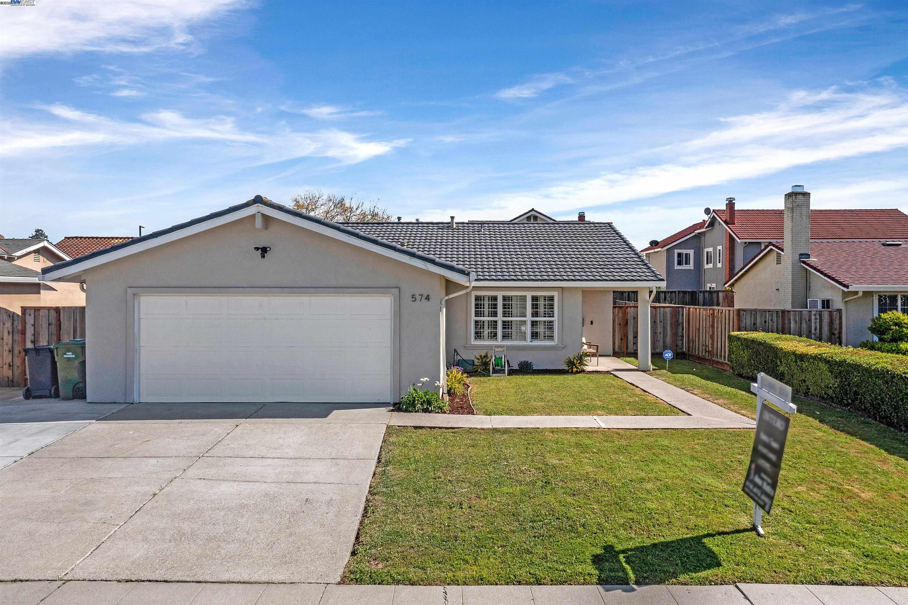 574 Tramway Drive Milpitas, CA 95035 - Photo 1 of 1 a front view of a house with a yard