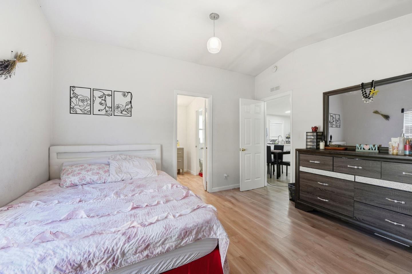 3637 Snell Avenue, Unit 248 San Jose, CA 95136 - Photo 13 of 33 a bedroom with a bed and a large mirror