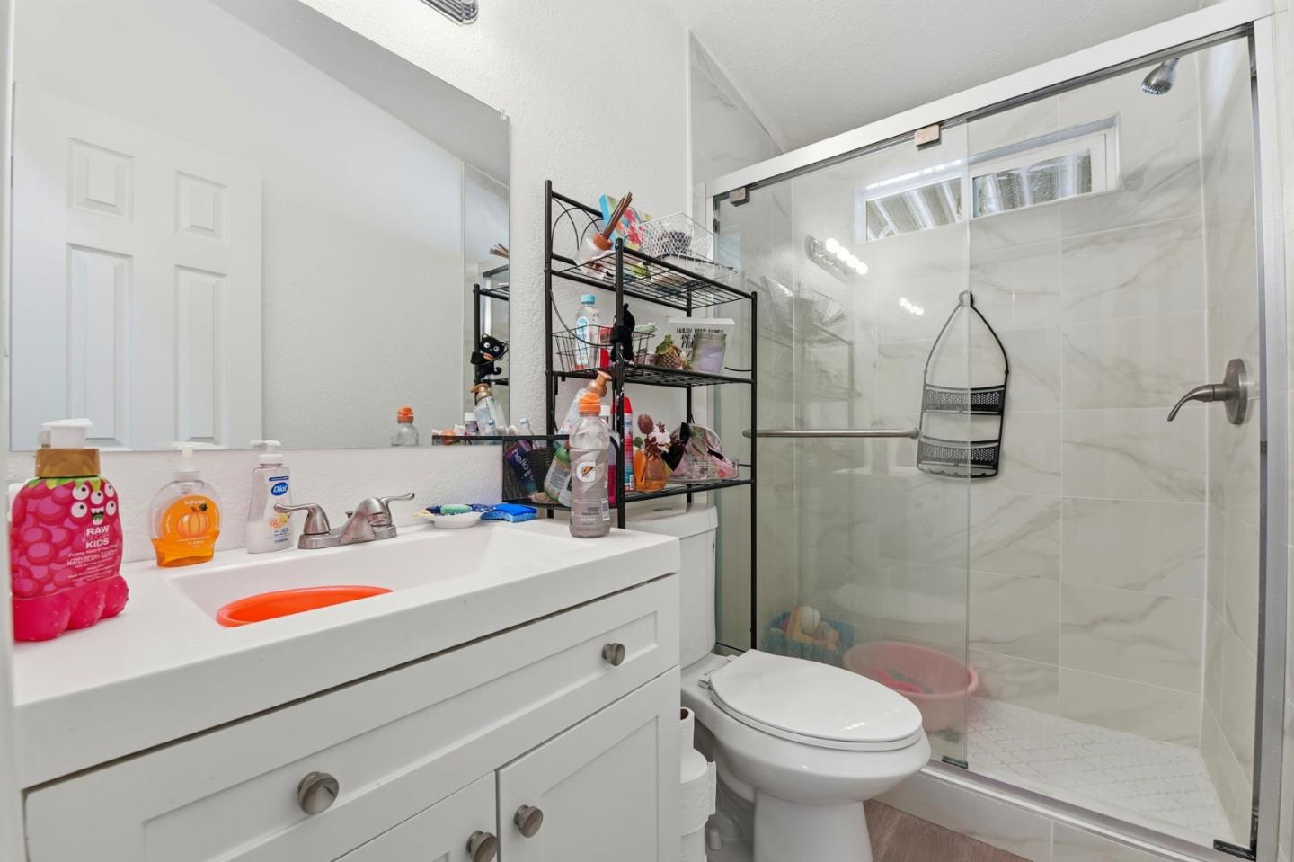3637 Snell Avenue, Unit 248 San Jose, CA 95136 - Photo 18 of 33 a bathroom with a sink toilet and shower