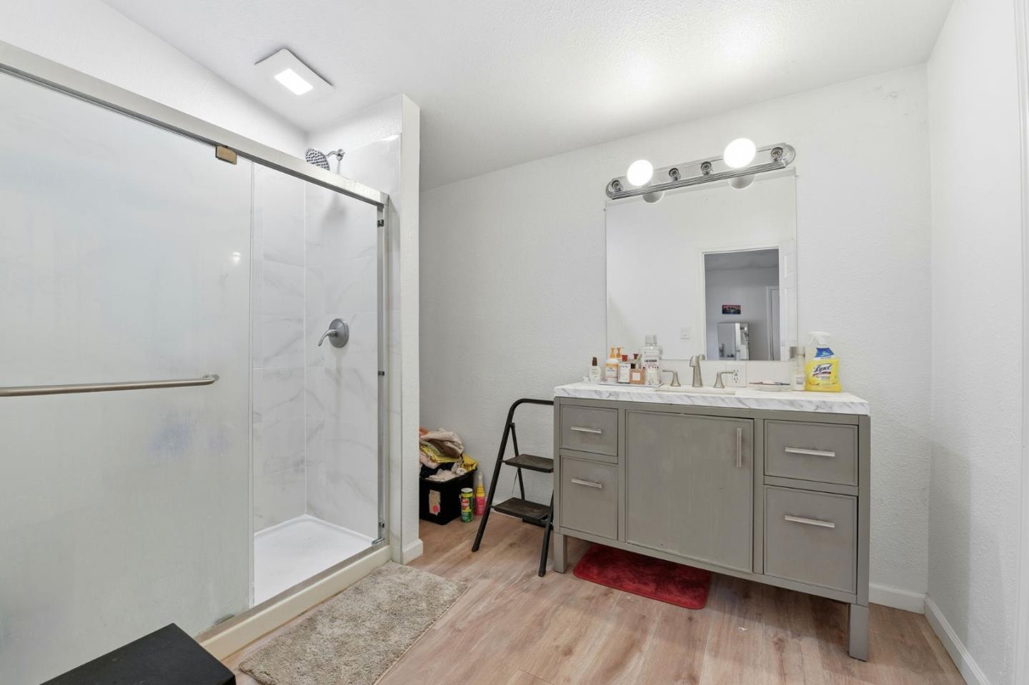 3637 Snell Avenue, Unit 248 San Jose, CA 95136 - Photo 19 of 33 a bathroom with a sink mirror and a shower