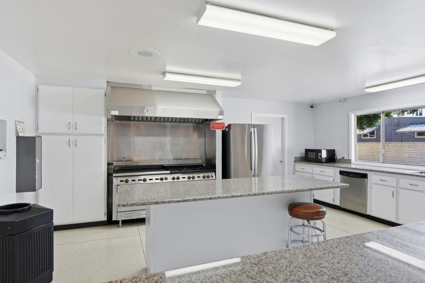 3637 Snell Avenue, Unit 248 San Jose, CA 95136 - Photo 24 of 33 a kitchen with stainless steel appliances a stove a sink and a refrigerator
