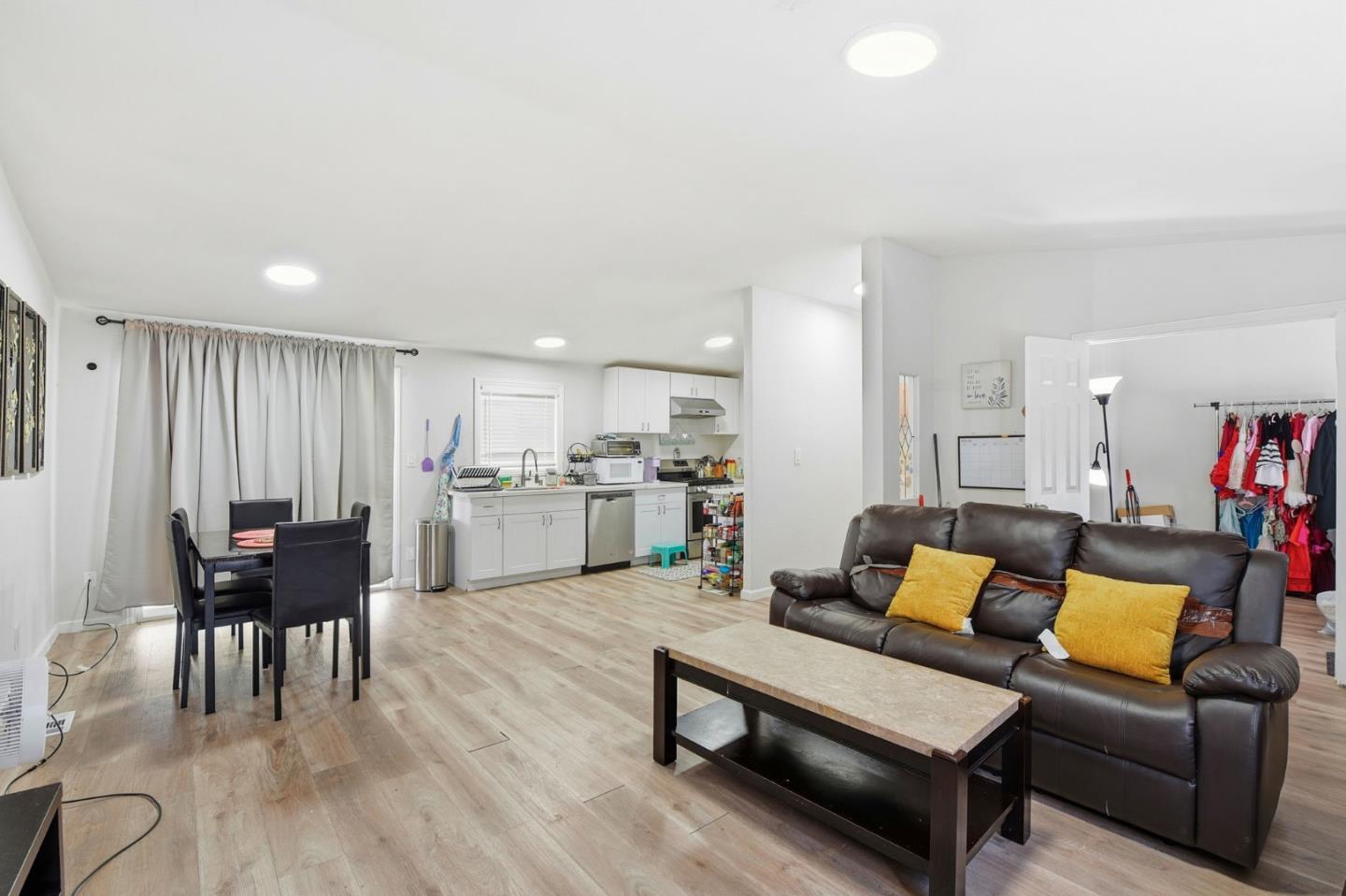 3637 Snell Avenue, Unit 248 San Jose, CA 95136 - Photo 5 of 33 a living room with furniture and a dining table with kitchen view