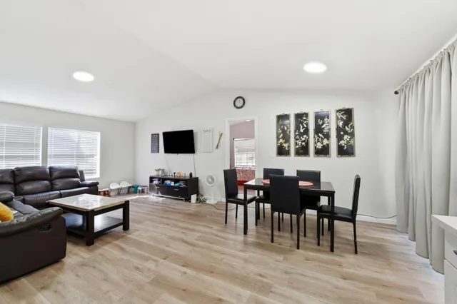 a living room with furniture and a table