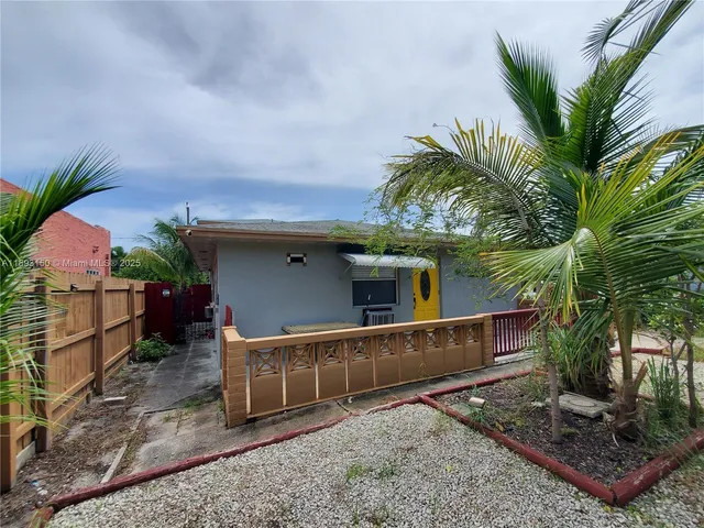 a house view with a garden space